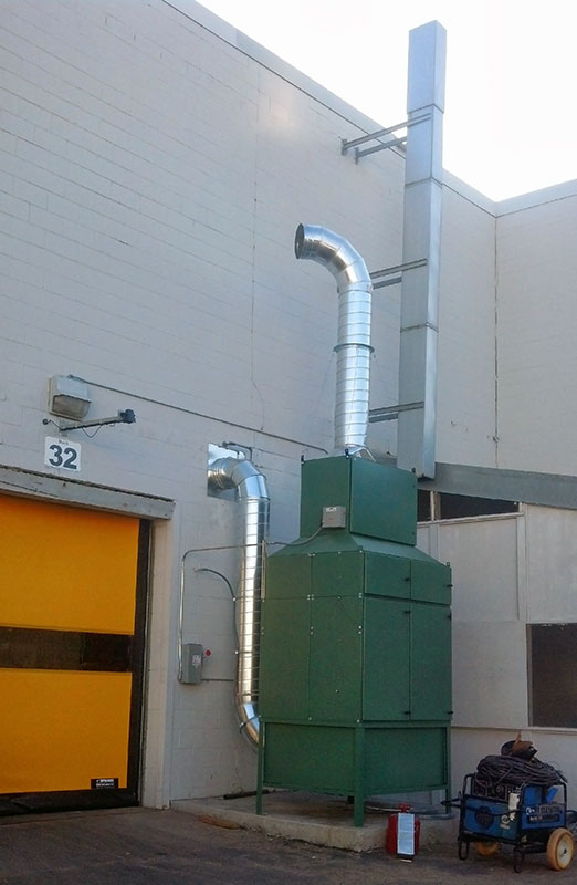 Vertical media collector mounted outside of the production facility